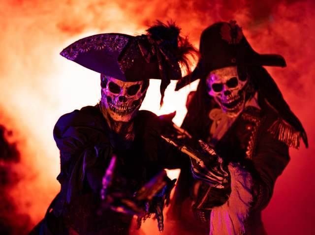 Two characters dressed up as skull pirates at the San Antonio Botanical Garden.
