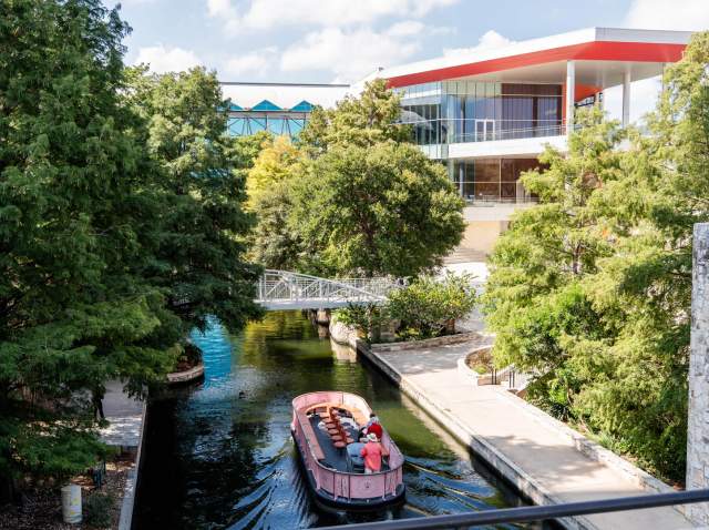 View of exterior Henry B. Gonzalez Convention Center building overlooking the San Antonio River Walk.