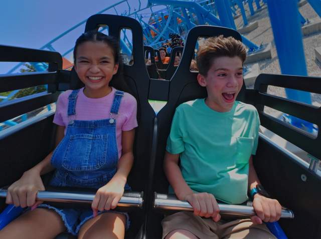 Kids laughing on roller coaster at SeaWorld San Antonio.
