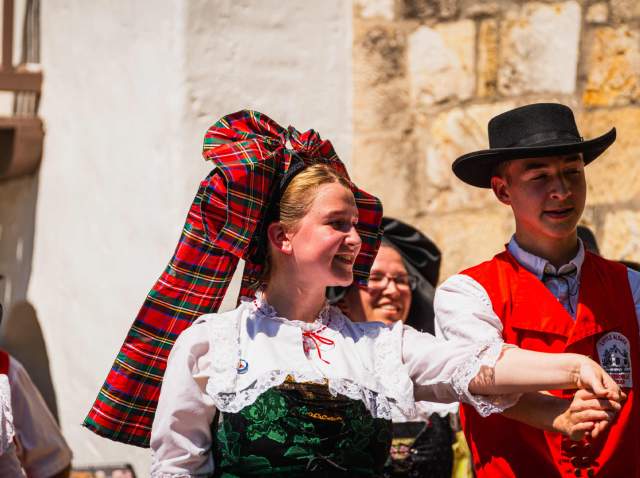 Man and woman dancing at Oktoberfest celebration in San Antonio.