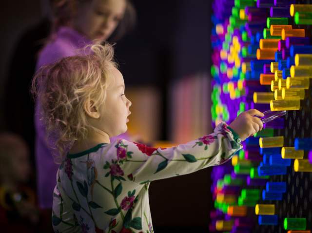 children interacting with exhibit at Doseum