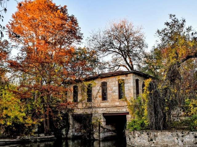 Stone building surrounded by trees