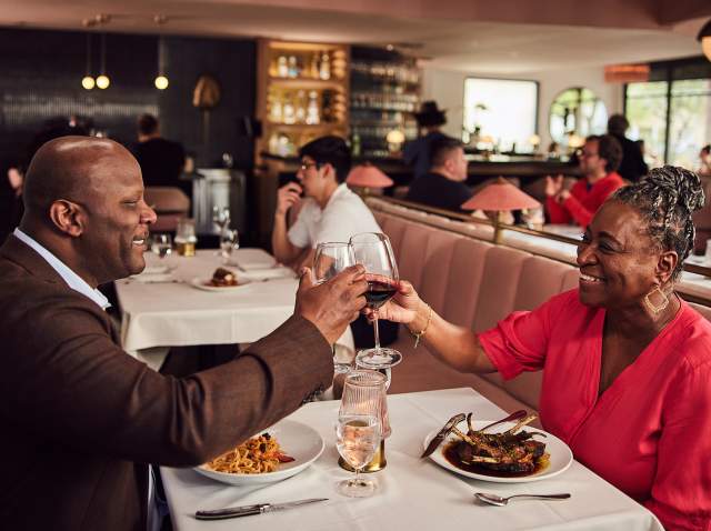 Couple toasting at dinner