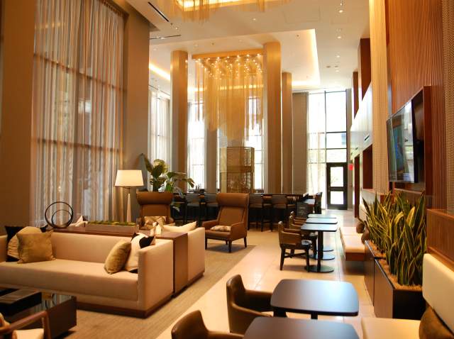Tables and chairs in lounge area of AC Marriott.