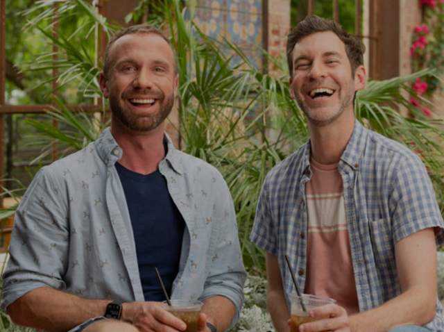 Two men smiling and laughing