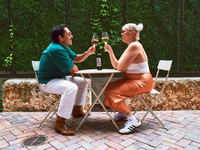Couple enjoying wine cheersing