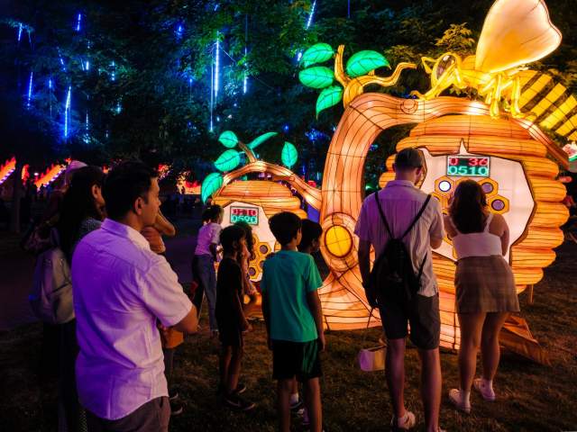 family at illuminate event at botanical garden