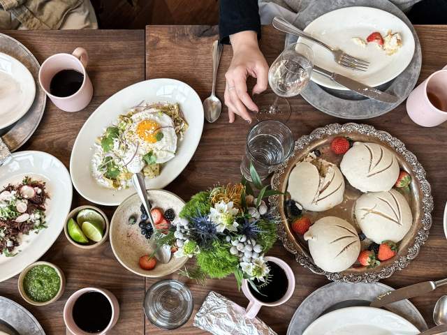 food spread out on a table with brunch food