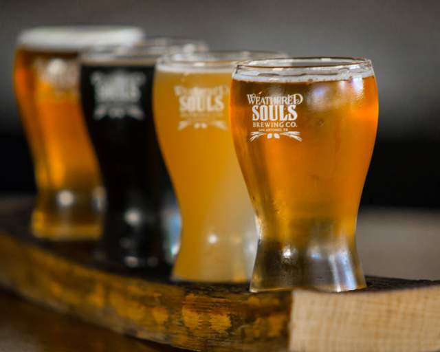 Flight of craft beers in tall glasses