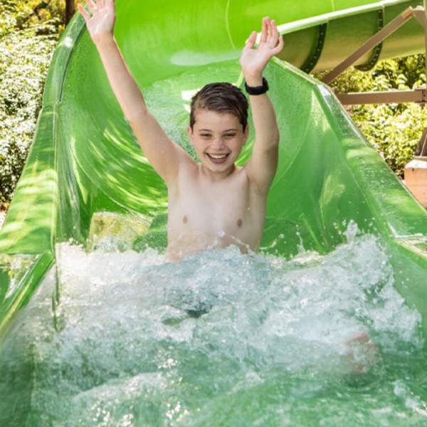 Child splashing down waterslide