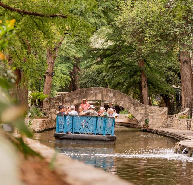 The San Antonio River Walk with a barge
