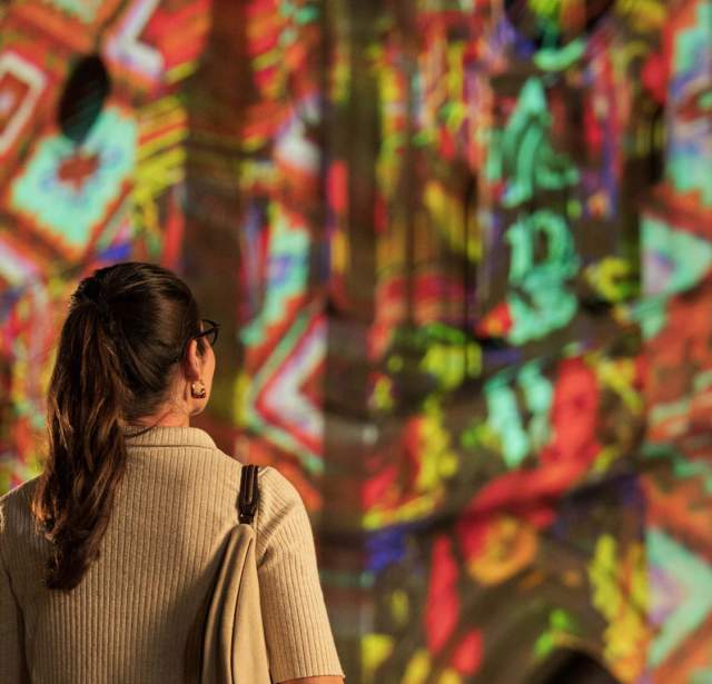 Woman looking at San Antonio | The Saga show at San Fernando Cathedral.
