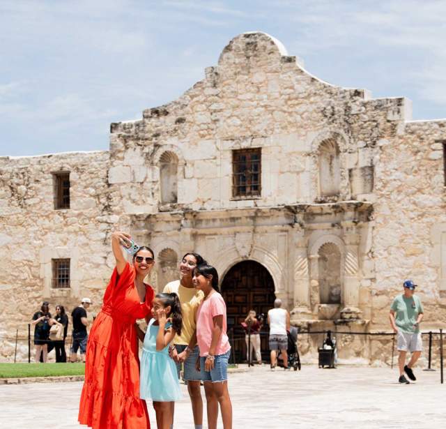 Family taking selfie at the Alamo.