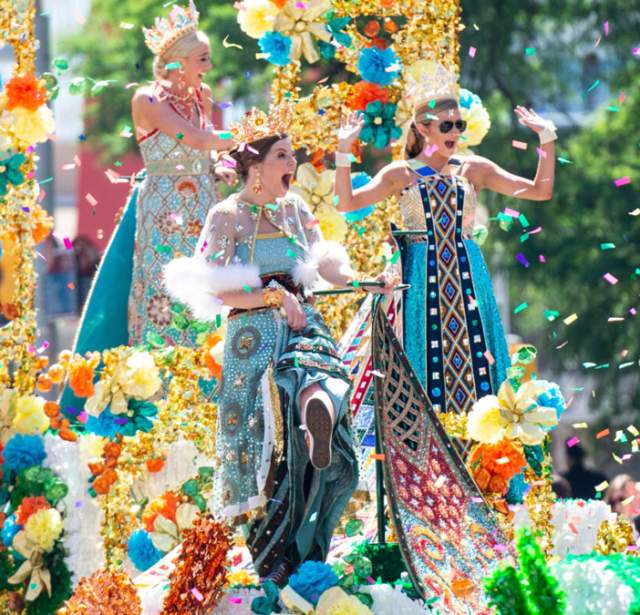 Fiesta Royalty on parade float surrounded by confetti