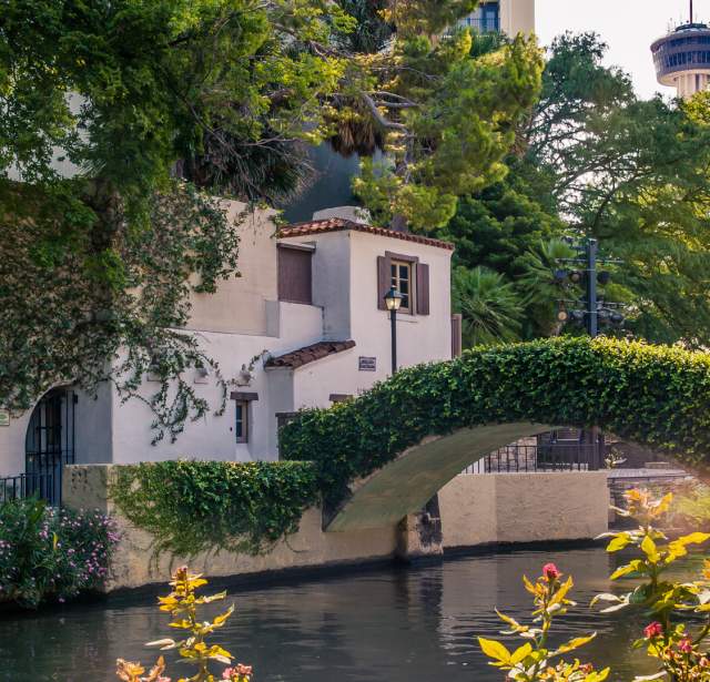 The River Walk bridge with Tower of the Americas in background