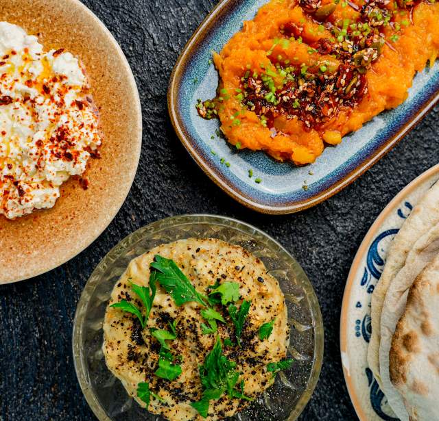 Overhead view of food including humus