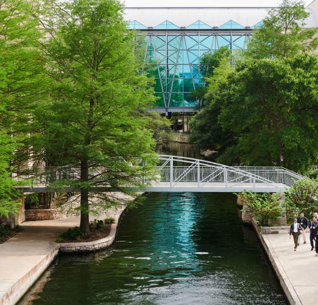 Professionals walking near bridge at Henry B. Gonzalez Convention Center