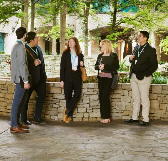 Group of meeting professionals gathering in front of grotto at Henry B.Gonzalez Convention Center