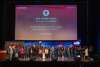 Group of people gathered onstage