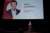 Man onstage talking