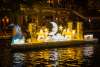 Moon and stars illuminated on river barge