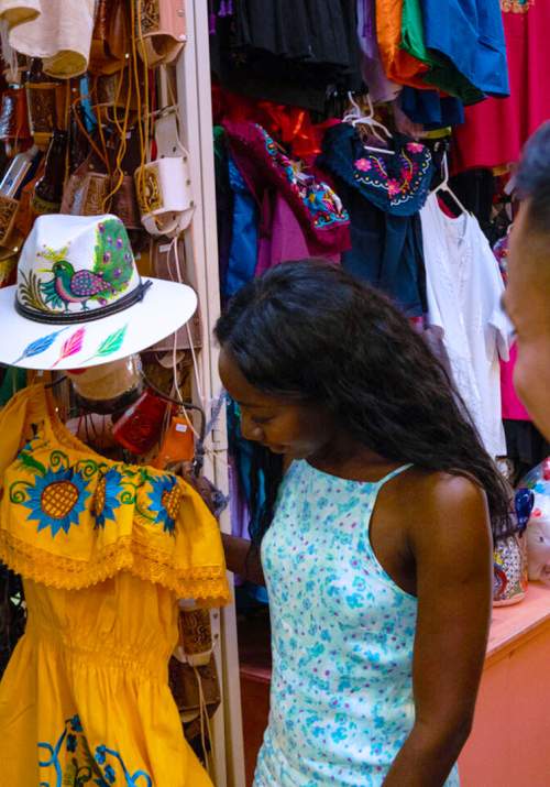 Man and woman shopping and looking at clothes
