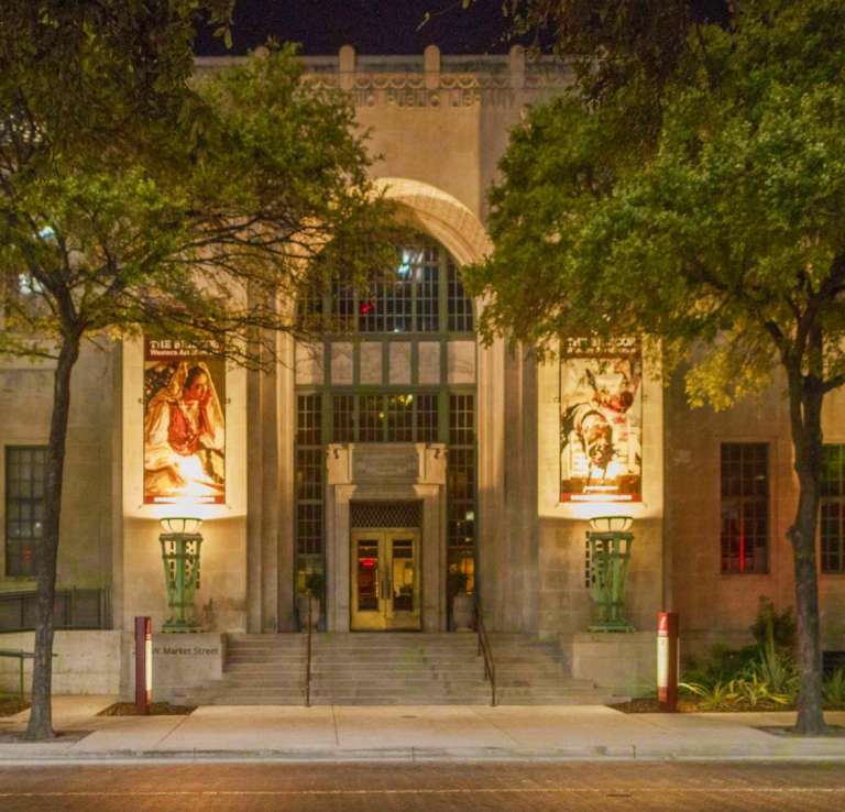Exterior view of Briscoe Western Art Museum building in San Antonio at night with ambient lighting.