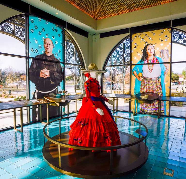 Interior view of World Heritage Center and mannequin in red dress.
