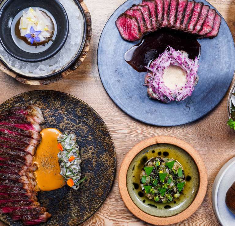 Overhead view of food spread at Isidore at Pullman Market in San Antonio.