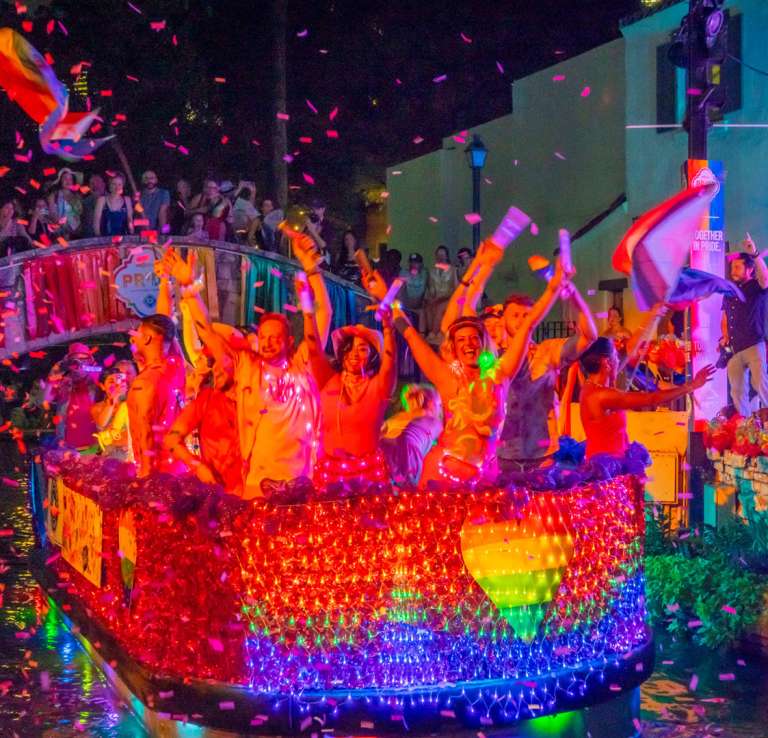 Colorful float at Pride River Parade on San Antonio River Walk