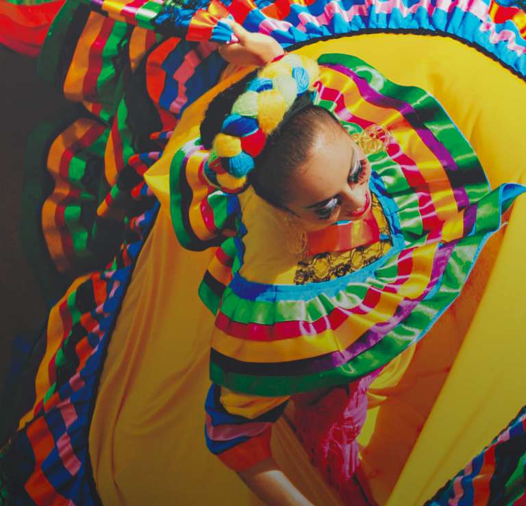 Woman dancing in colorful dress