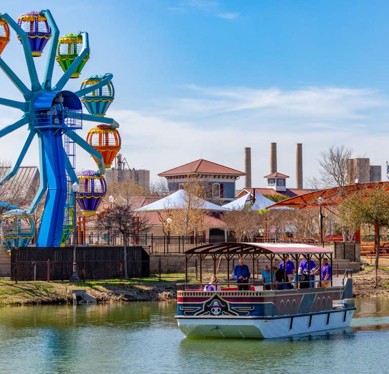 Overview of Morgan's Wonderland with ferris wheel and passenger boat