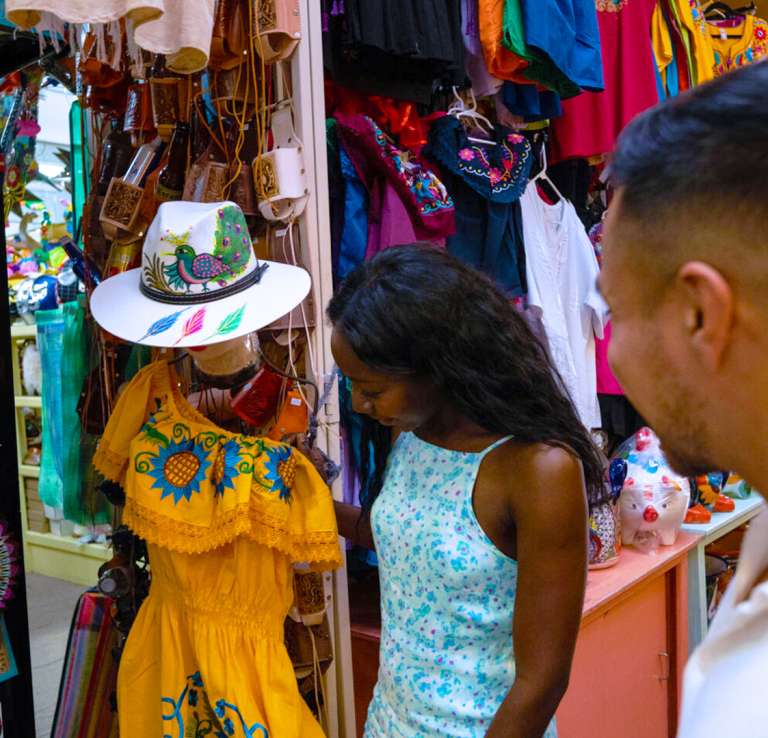 Man and woman shopping and looking at clothes