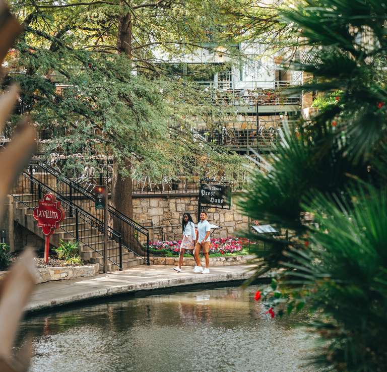 Couple strolling along River Walk