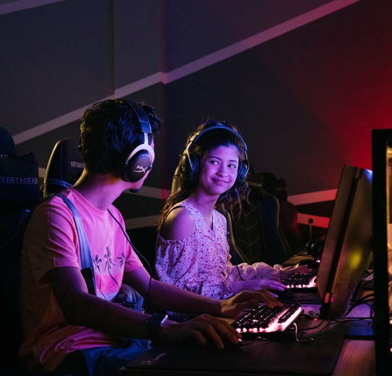 Boy and girl with headphones at Tech Port San Antonio