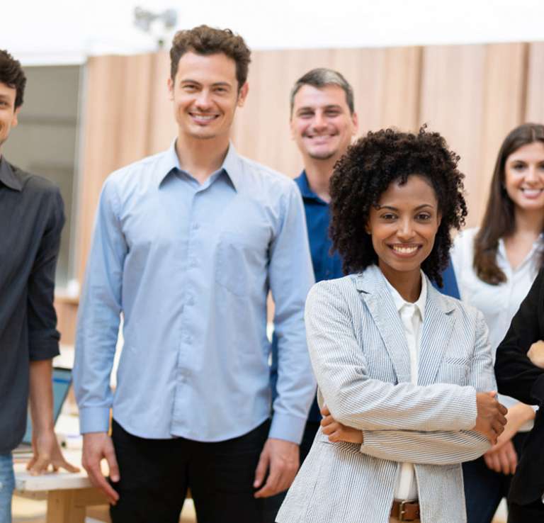 group of smiling staff