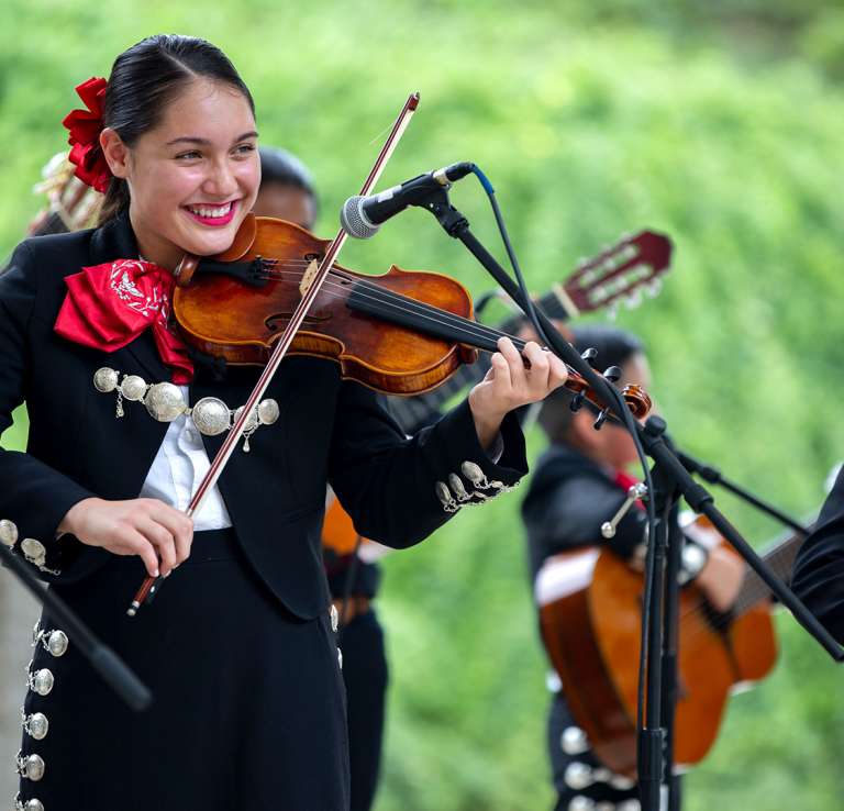 Mariachi band member playing violin