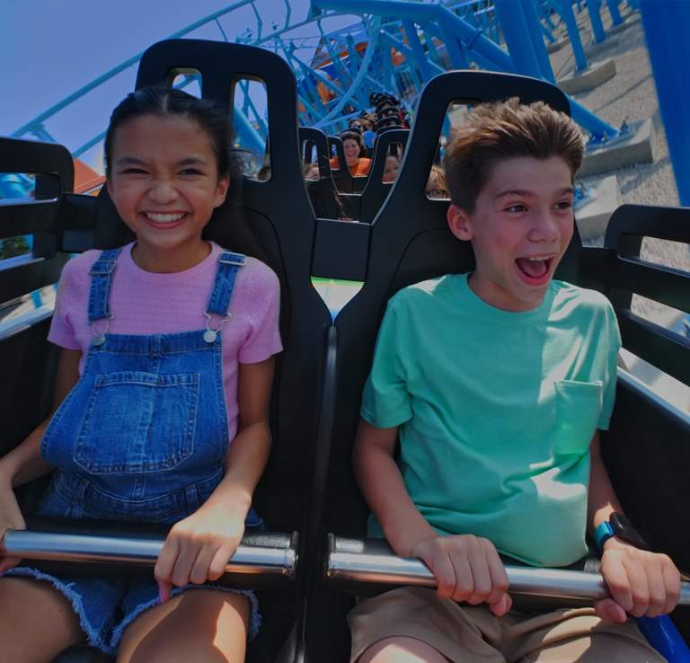 Kids laughing on roller coaster at SeaWorld San Antonio.