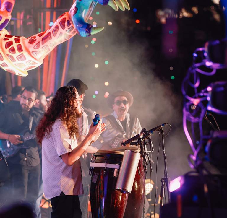 Band members on stage performing