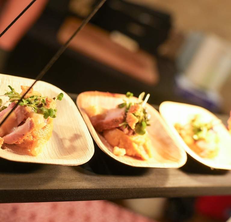 Delicacy food spread with lightbulb in distance