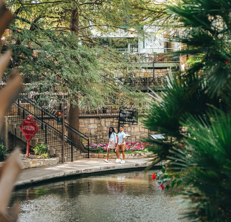Couple strolling along River Walk