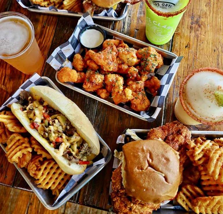 Overhead view of food spread including drinks