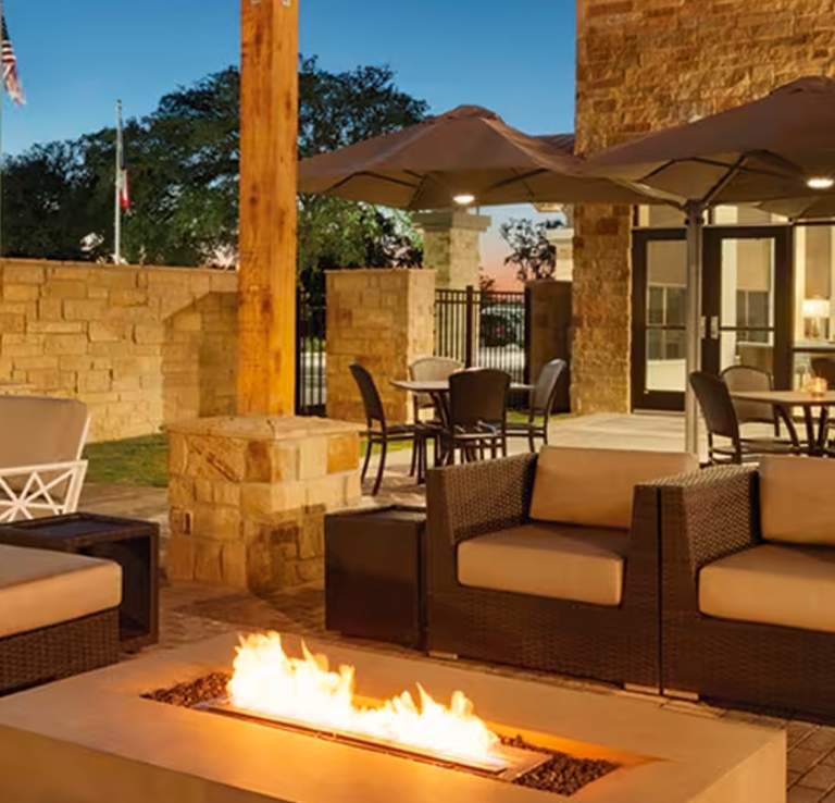 Luxury outdoor hotel patio with fireplace