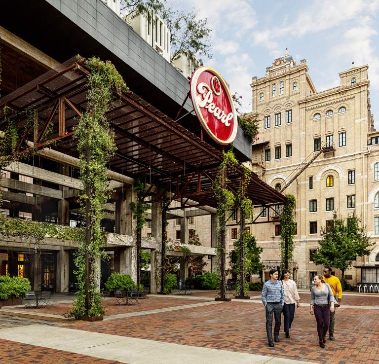 Professionals walking through Pearl Courtyard