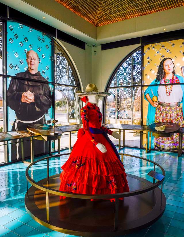 Interior view of World Heritage Center and mannequin in red dress.