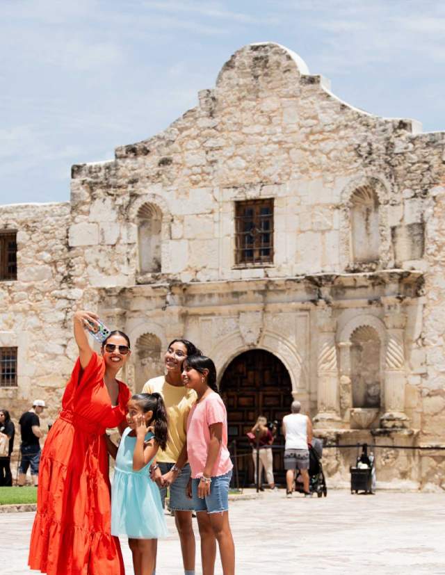 Family taking selfie at the Alamo.