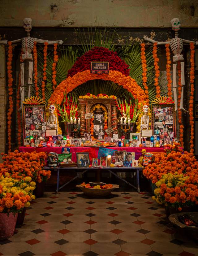 Day of the Dead Altar with many marigolds and photos on display at Hotel Emma.
