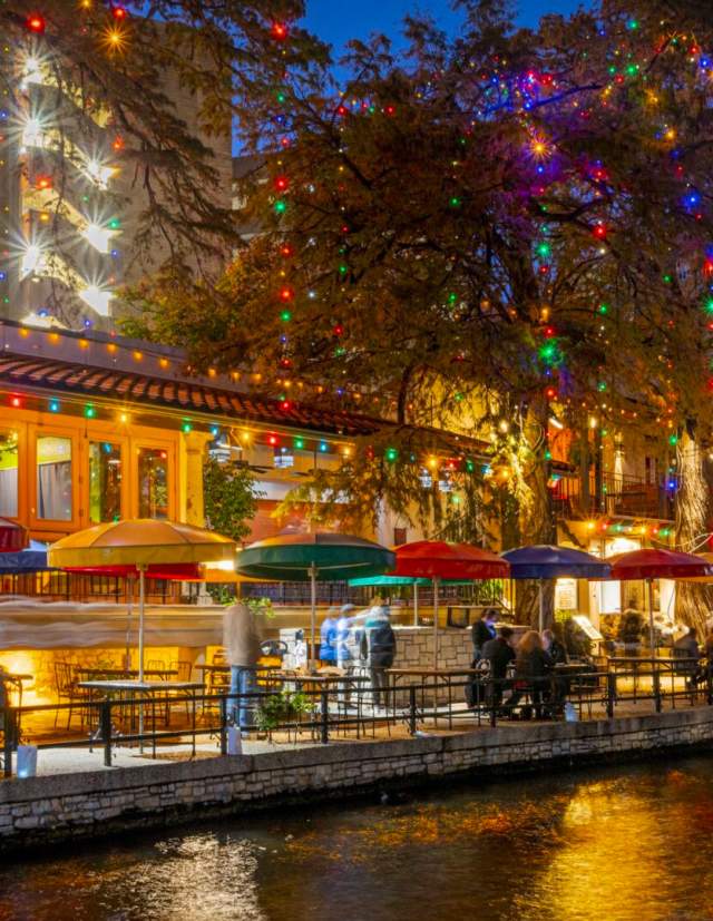 River Walk view with holiday lights adorned on trees