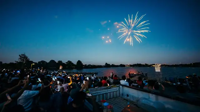 People watching fireworks at Woodlawn Lake Park in San Antonio.