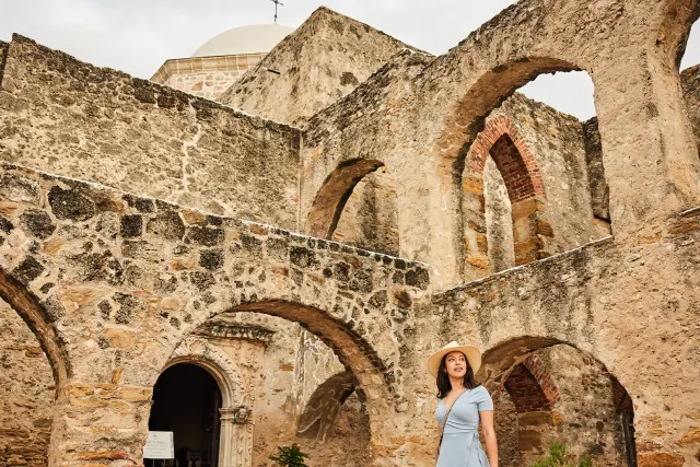 Woman walking through Mission San Jose in San Antonio Missions National Historical Park